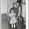 Spanish-American farmer with his daughter. Chamisal, New Mexico