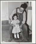 Spanish-American farmer with his daughter. Chamisal, New Mexico