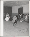Acrobat and audience at Spanish-American traveling show. Penasco, New Mexico