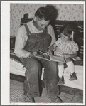 Spanish-American farmer and his daughter. Chamisal, New Mexico