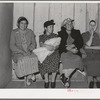Spanish-American women waiting to see doctor at the traveling clinic at Chamisal, New Mexico
