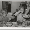 Children of Mormon farmer at dinner. Box Elder County, Utah