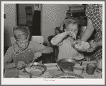 Children of Mormon farmer at dinner. Box Elder County, Utah