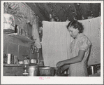 Mrs. Jack Whinery working in kitchen of her dugout. Pie Town, New Mexico