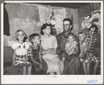 Mr. and Mrs. Jack Whinery and their five children in their dugout. Pie Town, New Mexico. Mr. Whinery had worked on farms in Texas for wages until homesteading one year ago