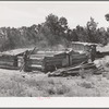 Faro Caudill and neighbor John Adams tearing down dugout. Pie Town, New Mexico