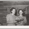 Two sisters singing a duet at the community sing. Pie Town, New Mexico