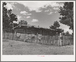 Log house of farmer with a fence of hand-split rails. Pie Town, New Mexico