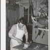 Butcher at the commissary. Mogollon, New Mexico