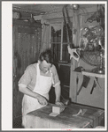 Butcher at the commissary. Mogollon, New Mexico