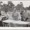 Farm women getting dinner ready at the all-day community sing. Pie Town, New Mexico