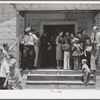 People leaving the church for dinner at the community sing. Pie Town, New Mexico