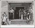 People leaving the church for dinner at the community sing. Pie Town, New Mexico