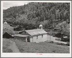 Church surrounded by miners' homes. Mogollon, New Mexico