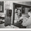 Workers at mine receiving paychecks. Mogollon, New Mexico