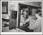 Workers at mine receiving paychecks. Mogollon, New Mexico