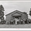 Crowd outside the church during the dinner hour at the community sing. Pie Town, New Mexico
