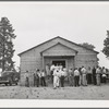 Crowd outside the church during the dinner hour at the community sing. Pie Town, New Mexico