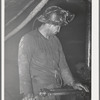 Gold miner operating pneumatic drill. Mogollon, New Mexico