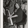 Pianist at community sing. Pie Town, New Mexico. She and her husband were one of the first homesteaders