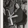 Pianist at community sing. Pie Town, New Mexico. She and her husband were one of the first homesteaders