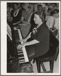 Pianist at community sing. Pie Town, New Mexico. She and her husband were one of the first homesteaders