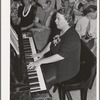 Pianist at community sing. Pie Town, New Mexico. She and her husband were one of the first homesteaders
