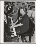 Pianist at community sing. Pie Town, New Mexico. She and her husband were one of the first homesteaders