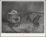 Mucking gold ore at mine. Mogollon, New Mexico
