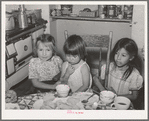 Spanish-American children at the dinner table. Chamisal, New Mexico