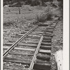 Abandoned railroad leading to abandoned mine. San Juan County, Colorado. When the mines moved out, whole towns and affiliated industries folded up