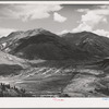 Silverton, Colorado lies in a valley at 9400 feet elevation. This has been a center for mining and milling operations and the tailing-choked Animas River can be seen at left