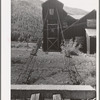 Cable supports of aerial tramway leading through wheel house. Abandoned mill in San Juan County, Colorado