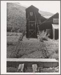 Cable supports of aerial tramway leading through wheel house. Abandoned mill in San Juan County, Colorado