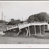 Bridge in Tehama County, California, which was washed out in recent flood of the Sacramento River. Shasta Dam will control a large amount of these flood waters