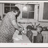 Mrs. J. Webster ironing while her sons look on. Tehama County, California