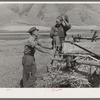 Neighboring farmer asking one of the members of the Olsen cooperative binder when custom work could be done for him. Mantua, Utah