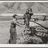 Neighboring farmer asking one of the members of the Olsen cooperative binder when custom work could be done for him. Mantua, Utah