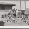 Distributing newspapers to newsboys at the railroad station. Montrose, Colorado