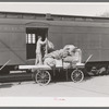 Taking off the mail at the morning train. Montrose, Colorado