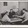 FSA supervisor handing check to chairman of committee for purchase of cooperative ensilage harvester. Cornish, Utah