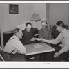 FSA supervisor handing check to chairman of committee for purchase of cooperative ensilage harvester. Cornish, Utah