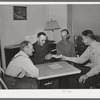 FSA supervisor handing check to chairman of committee for purchase of cooperative ensilage harvester. Cornish, Utah