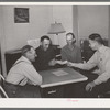 FSA supervisor handing check to chairman of committee for purchase of cooperative ensilage harvester. Cornish, Utah