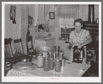 Mrs. Christiansen of the Christiansen canning unit sealing cans. During 1939 she canned 2300 quarts which included 20 mutton, 2 deer, 2 beeves, 5 pigs. Fish was tried very successfully. In this cooperative agreement there were twenty-five users and outside of the cooperative there were ten others who used Mrs. Christiansen's services