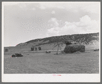 Putting up hay with homemade tractor and stacker. Ouray County, Colorado