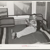 Worker in bunkhouse room at the Earl Fruit Company ranch. Kern County, California