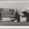 Sign and real estate office at Central Valley, California, boom town near Shasta Dam