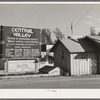 Sign and real estate office at Central Valley, California, boom town near Shasta Dam