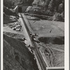 Many miles of the Southern Pacific railroad had to be enrouted and new tunnels and track constructed to take care of impounding of water by Shasta Dam. Shasta County, California